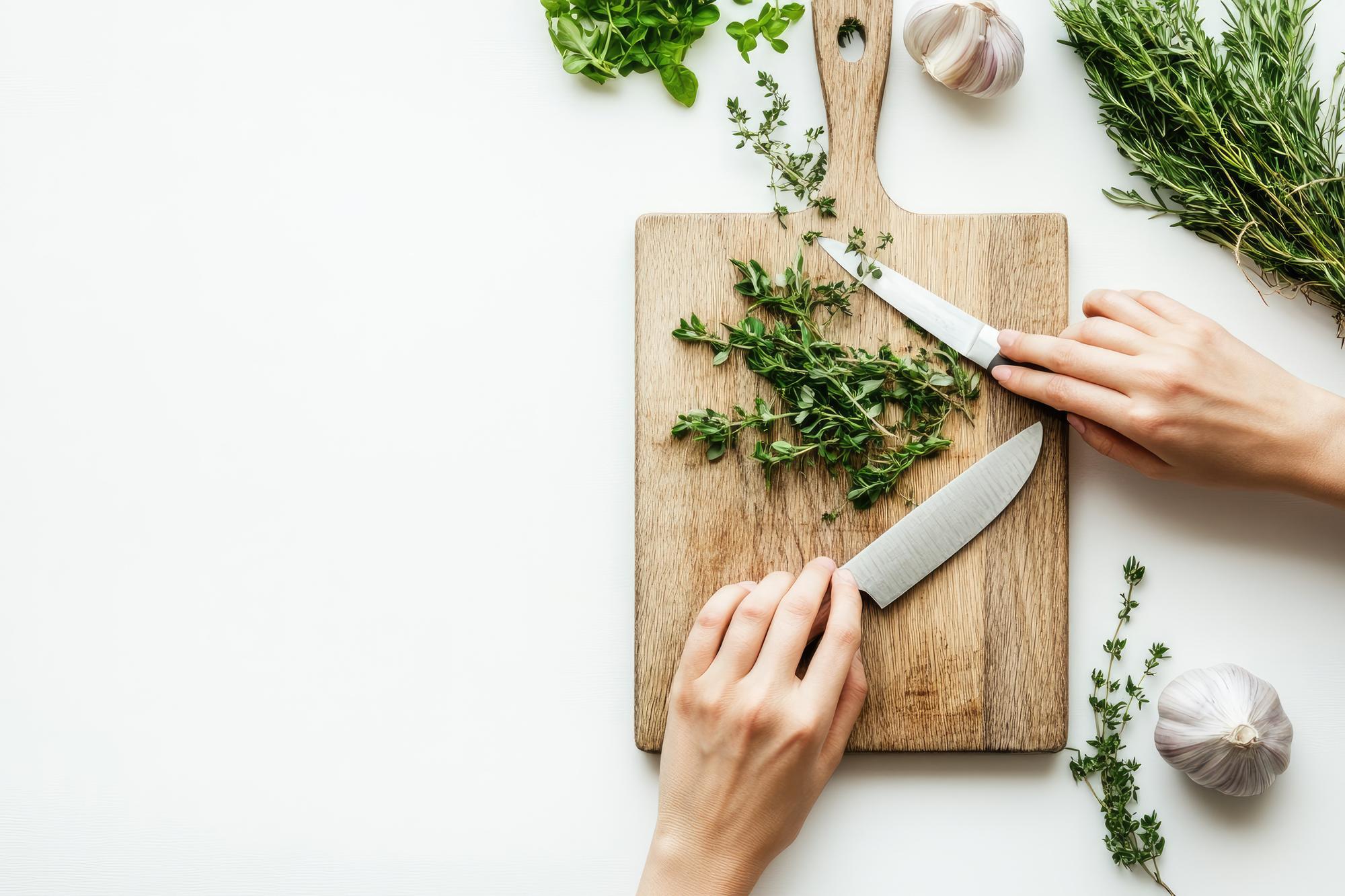 close up hands chopping herbs